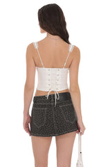 Low Rise Polka Dot Denim Mini Skirt in Faded Black