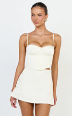 Quilla Mini Skirt - Mid Waist Faux Button Front Skirt in Cream