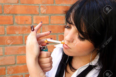 Beautiful Woman Lights A Cigarette Stock Photo, Picture and Royalty Free Image. Image 5532319