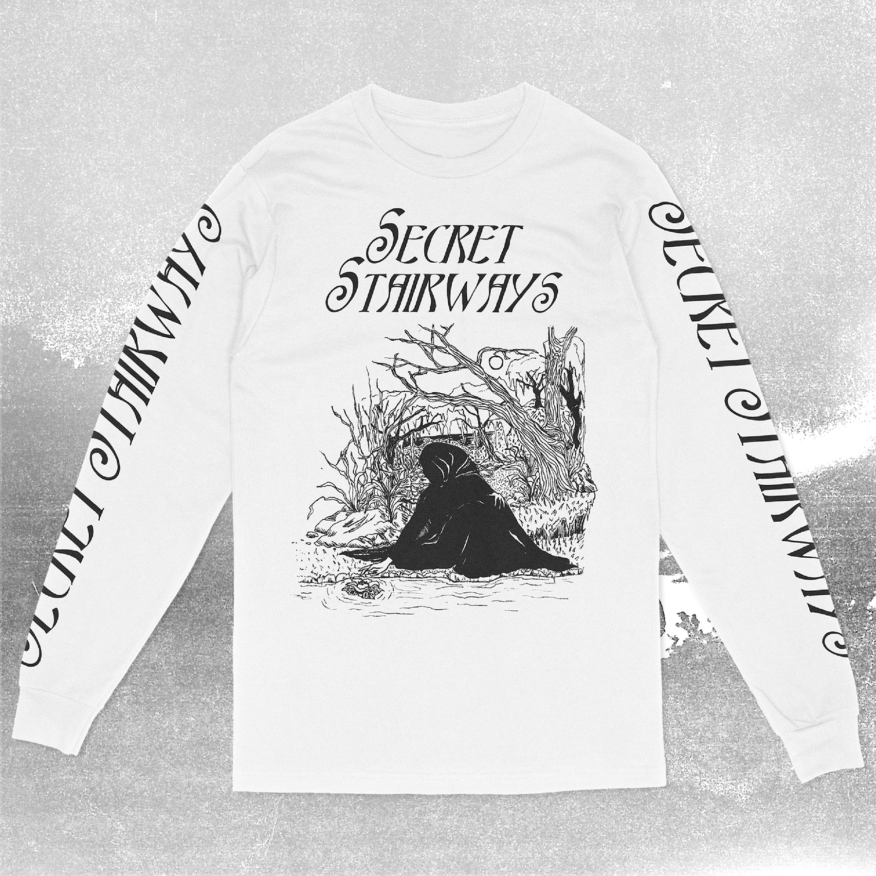 A white long sleeve t-shirt with 'Secret Stairways' text and artwork featuring a dark fantasy scene printed on it. Both sleeves read "Secret Stairways"