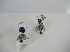 delftblue and multicolor ceramic puppies