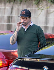 Dave Grohl puffs on a cigarette, appears stressed after mother of his  secret love child is revealed