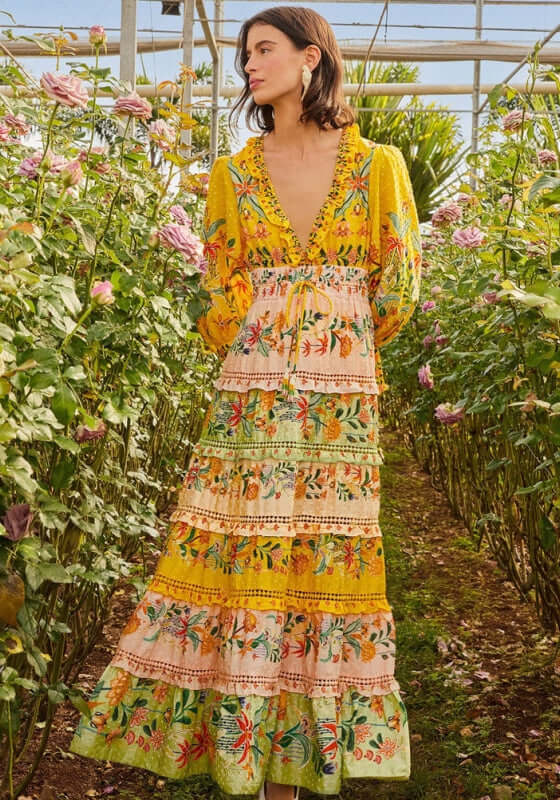 Delicate Flowers Stripes Maxi Dress by Farm Rio, featuring vibrant floral patterns and tiered design in a lush garden setting.