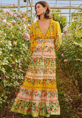 Delicate Flowers Stripes Maxi Dress by Farm Rio, featuring vibrant floral patterns and tiered design in a lush garden setting.