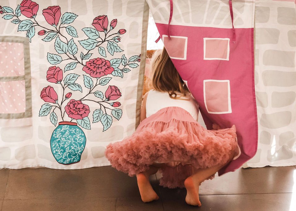 Child playing inside Home Sweet Home Table Tent cubby on dining table