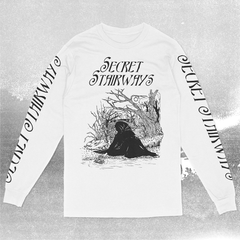 A white long sleeve t-shirt with 'Secret Stairways' text and artwork featuring a dark fantasy scene printed on it. Both sleeves read "Secret Stairways"